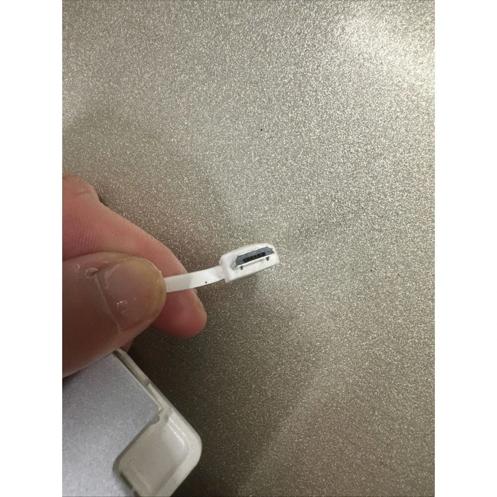 Ultra Slim portable charger silver with looks like Micro-USB cord see photos